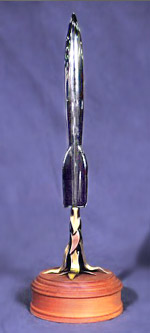 photo of 2004 Hugo, rising on a column of copper and brass flames